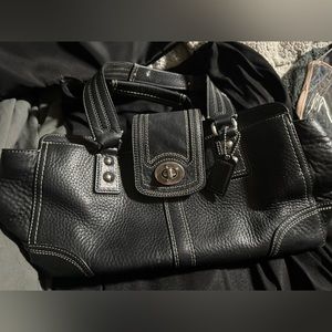 Black Coach bag with burgundy lining